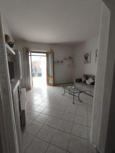 a living room with a couch and a table at Casa Spartaco in Certaldo
