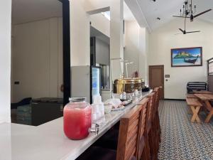 a long counter in a room with aasteryasteryasteryasteryasteryasteryasteryastery at Bliss By Stays,Calangute in Calangute