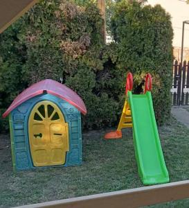 two childrens playyards with a play house and a slide at Dombi-Lak in Tiszakécske +7 photos
