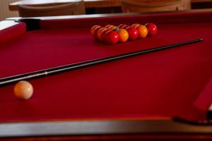 a group of balls on a pool table at BodyGo Hostel Briançon in Briançon