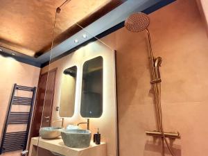 a bathroom with two sinks and a shower at DG kores in Metsovo +40 photos