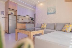 a living room with a couch and a table at Imsouane Sea surf Camp in Imsouane