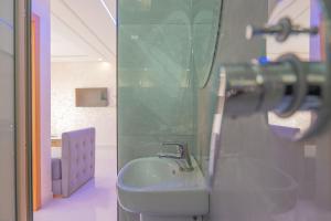 a bathroom with a sink and a mirror at Imsouane Sea surf Camp in Imsouane +79 photos