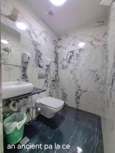 a bathroom with a toilet and a sink at An ancient pal ace in Cairo +27 photos