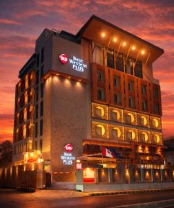 a hotel building with lights on it at night at Best Western Plus Grand Multan in Multan
