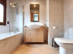 a bathroom with a sink and a shower and a toilet at AC Apartaments Sol Tarter in El Tarter
