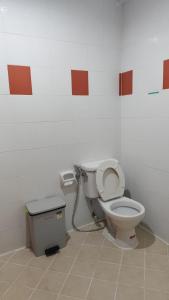 a bathroom with a toilet and a trash can at jdreamboxhostelpatong in Patong Beach +14 photos