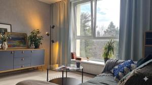 a living room with a couch and a window at Hiiu korter Kärdlas in Kärdla