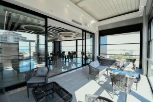 an open living room with a view of the ocean at Dorana Hotel Gazimagusa in Famagusta
