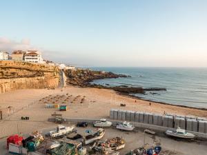 a view of a beach with boats on the sand at Casa do Largo Ericeira in Ericeira