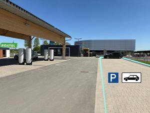 a parking lot at a car dealership with a parking meter at Roatel Willich A44 my-roatel-com in Willich