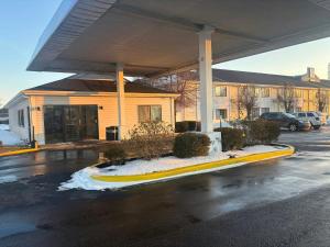 an empty parking lot in front of a building at Red Roof Inn Kokomo in Kokomo