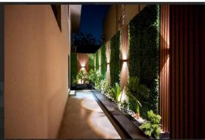 a hallway with plants on the side of a building at شقة مودرن مع جاكوزي خاص دخول ذاتي in Riyadh