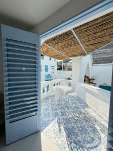 a room with a table and chairs on a tile floor at Casa El Eden in Puerto Triunfo