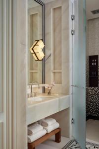 a bathroom with a sink and a shower at The St. Regis Budapest in Budapest