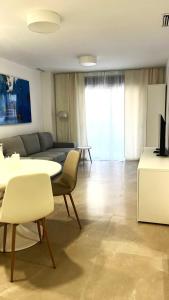 a living room with a couch and a table at Marina Luxury in Torrevieja