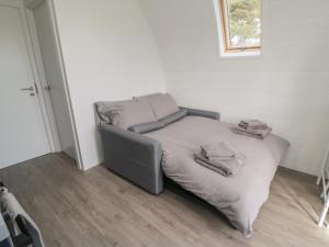 a bed in a corner of a room at Starlight Sanctuary in Malton +24 photos