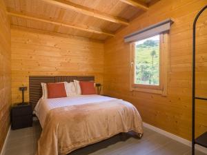 a bedroom with a bed in a wooden cabin at Rustic Home By CanariasGetaway in Telde +103 photos
