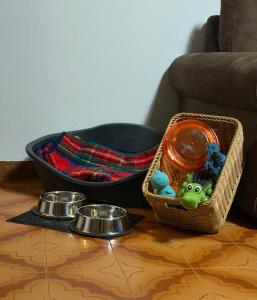 a table with a basket of food and a bowl of toys at Mountain Getaway Panoramic View - Pets Welcome in Gromo