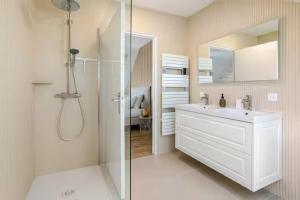 a white bathroom with a sink and a shower at Grande maison familiale centre ville - 2km des plages in Beaussais sur Mer +62 photos