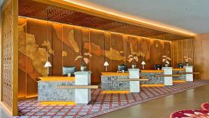 a lobby with a wall with a map of the world at The Singhasari Resort Batu in Batu +103 photos