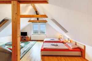 a bedroom with two beds in a attic at Ferienhaus Weitblick in Dresden