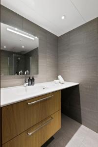 a bathroom with a sink and a mirror at Fyri Resort Nr 23 in Hemsedal +8 photos