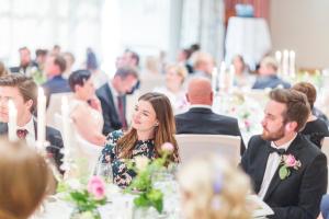 a group of people sitting at tables at a wedding at Hotel Union Geiranger Resort & Spa in Geiranger +74 photos