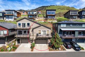 a house with a red circle on it in a city at River Scene 30 Night Minimum in White Salmon