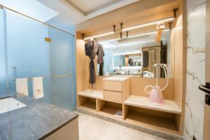 a bathroom with a sink and a mirror at The Panache Kautilya in Patna +39 photos
