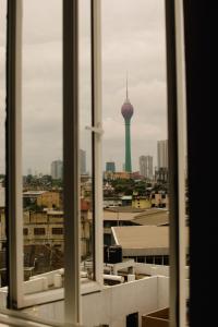 a view from a window of a city with a tower at Kings hotel in Colombo