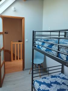 a room with two bunk beds and a staircase at LE CLOS BRAYON in Saint-Honoré
