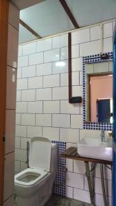 a bathroom with a toilet and a sink at Hotel YAN Residency Bhimtal - Nainital in Bhīm Tāl +118 photos