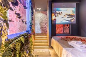 a room with a bed and a staircase with a painting at Int 37 Luxury Rooms in Rome