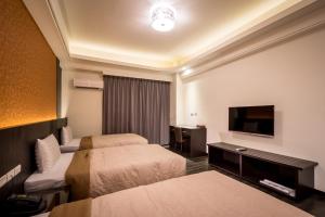 Postel nebo postele na pokoji v ubytování Yundu Business Hotel + 34 fotografií