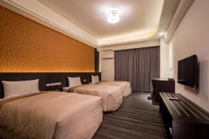 Ένα ή περισσότερα κρεβάτια σε δωμάτιο στο Yundu Business Hotel
