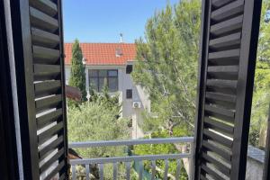a view of a house from a balcony at Punta Debij Select Apartments in Punat