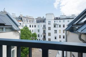 a balcony with a view of buildings at MINTNaschmarkt in Vienna