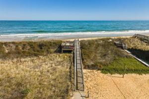 an aerial view of a sandy beach with the ocean at 4203 - Here Comes the Sun in Duck