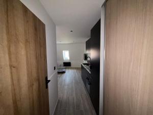 a hallway leading to a room with a living room at Duplex moderne hyper-centre Tout à pied in Thonon-les-Bains