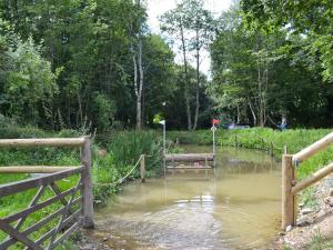 a flooded field with a fence and a pond at Judd in Launceston +8 photos