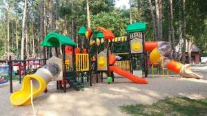 a playground with many different types of play equipment at Brda Hideaway in Głębokie