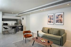 a living room with a couch and a table at master Shenkin in Tel Aviv