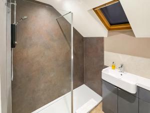 a bathroom with a shower and a sink at The Helmsley Retreat in Helmsley