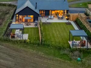 an aerial view of a house with a yard at Uk47692 - Wiggles Cottage in Wimbish +12 photos