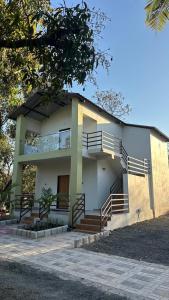 a building with stairs in front of it at Chandan resort in Chitrāwal
