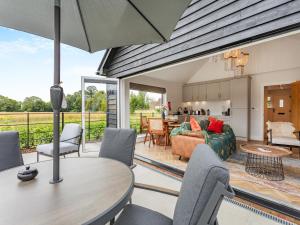a living room with a table and chairs at Uk47693 - Piglet Cottage in Wimbish