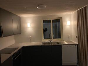 a kitchen with a sink and a window at Idyllic house in Timmernabben in Timmernabben