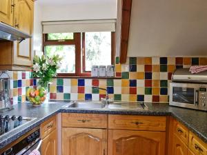 a kitchen with a sink and a window at Cider House in Launceston