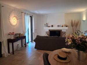 a living room with a couch and a table at Villa Argonaute in Saint-Tropez